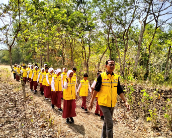 Local elementary school students participating in conservation activity